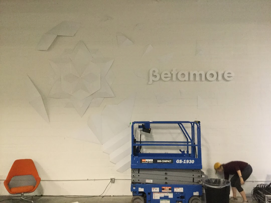 Installing geometric relief sculptures on Betamore wall at City Garage